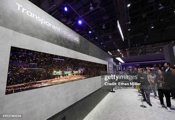 Ces Micro Led Transparency Attendees look at the world's first transparent MicroLED display ...