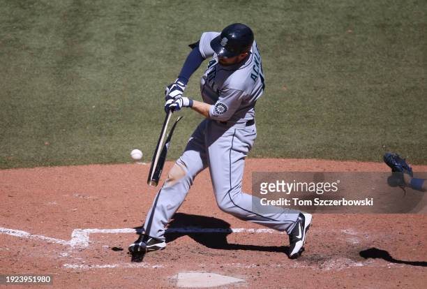 Dustin Ackley of the Seattle Mariners breaks his bat as he swings during MLB game action against the Toronto Blue Jays at the Rogers Centre on May 5,...