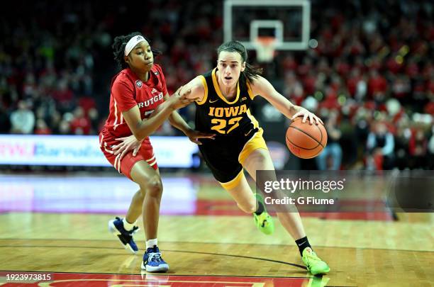 Caitlin Clark of the Iowa Hawkeyes handles the ball against Lisa Thompson of the Rutgers Scarlet Knights at Jersey Mike's Arena on January 05, 2024...