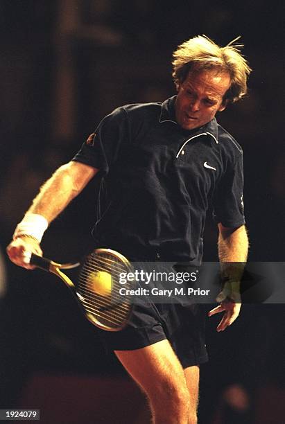 John Lloyd of Great Britain plays a backhand return during his match against Bjorn Borg of Sweden at the Honda Challenge for ATP Senior Tour of...