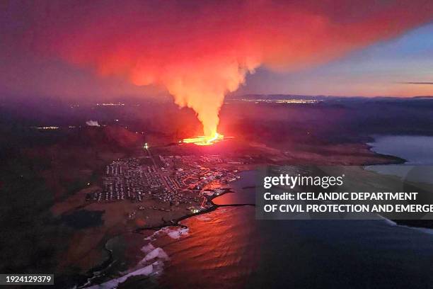 Billowing smoke and flowing lava are seen in this Icelandic Department of Civil Protection and Emergency Management , January 14 handout image during...