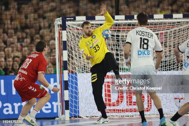 Andreas Wolff of germany saves a shot of Tim Rellstab of Switzerland during the Men's EHF Euro 2024 preliminary round match between Germany and...