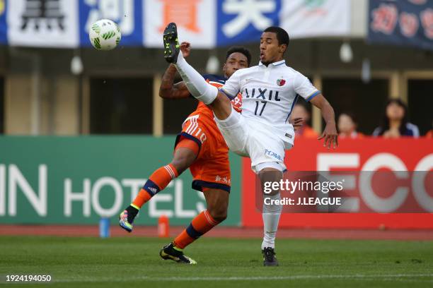 Rafael Silva of Albirex Niigata and Wellington Daniel Bueno of Kashima Antlers compete for the ball during the J.League J1 second stage match between...