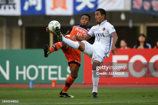 Rafael Silva of Albirex Niigata and Wellington Daniel Bueno of Kashima Antlers compete for the ball during the J.League J1 second stage match between...