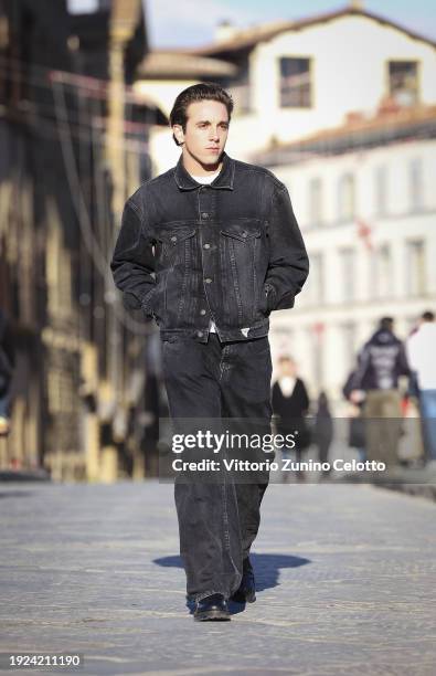 Alex Midler poses for a street style shooting during the GUESS JEANS "The Next 40 Years Of Denim" launch on January 09, 2024 in Florence, Italy.