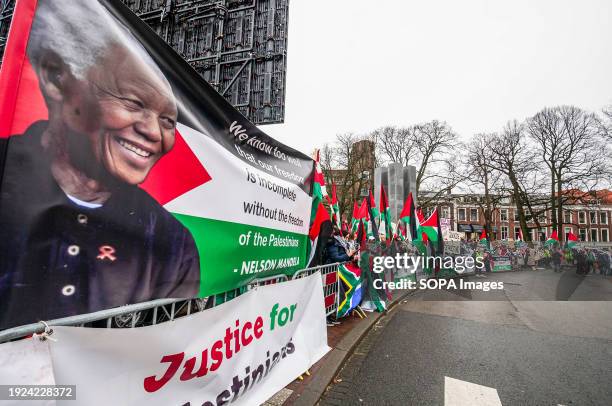 Placard with a portrait of Nelson Rolihlahla Mandela, during International Court of Justice . Hundreds of pro-Palestinian supports and a few...