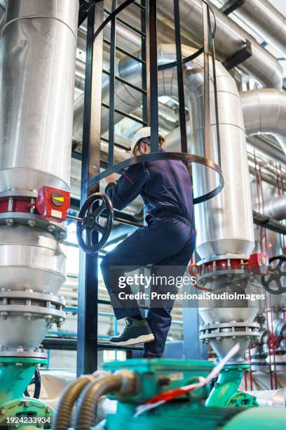 repairing heating plant equipment - gas water heater stock pictures, royalty-free photos & images