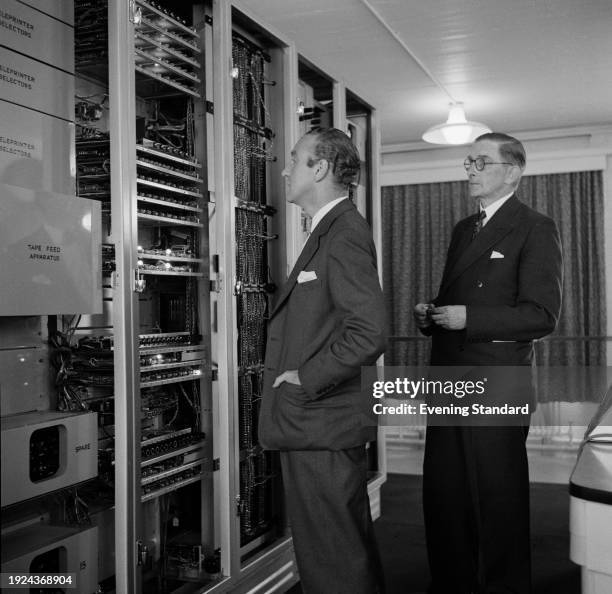 Postmaster General Ernest Marples viewing the Electronic Random Number Indicator Equipment at the Post Office Research Station, Dollis Hill, North...