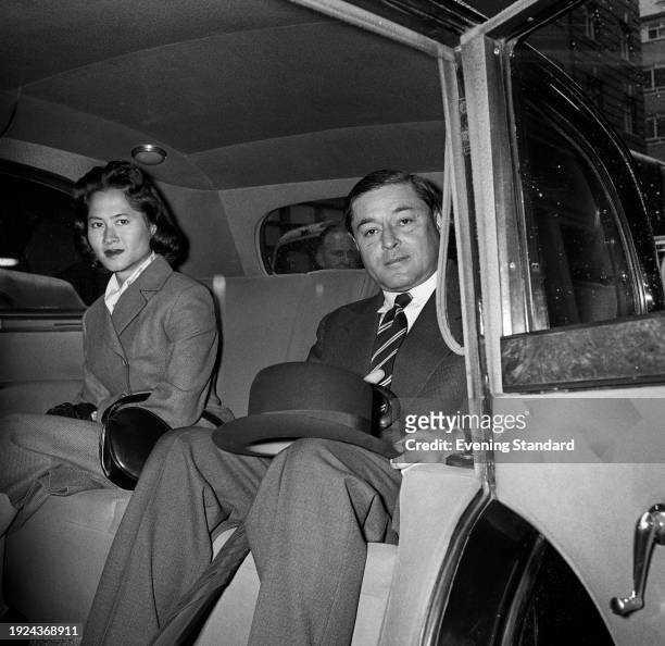 Prince Chula Chakrabongse of Thailand and his cousin, Princess Galyani Vadhana , seated in the back of a car, June 6th 1957.
