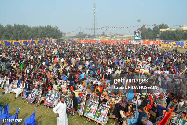 Supporters of Pakistan Peoples' Party listen to their chairman and Prime Ministerial candidate Bilawal Bhutto Zardari during a campaign rally for the...