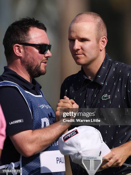 Yannik Paul of Germany shakes hands with his caddie on the ninth green on Day One of the Dubai Invitational at Dubai Creek Golf and Yacht Club on...