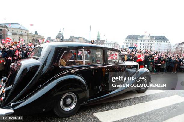 Crown Prince Frederik of Denmark looks from the window during a ride in the car Krone 1 from the Amalienborg Castle to the Christiansborg Castle,...