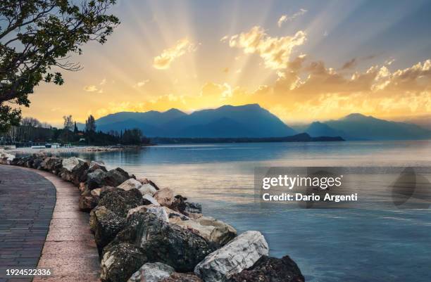 enchanting sunset on lake garda - desenzano del garda stock pictures, royalty-free photos & images