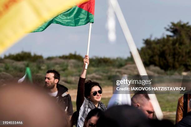 Peace protesters gather in front of the gates of the Royal Air Force Akrotiri base, a British overseas territory near the Cypriot coastal city of...