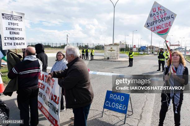 Peace protesters gather in front of the gates of the Royal Air Force Akrotiri base, a British overseas territory near the Cypriot coastal city of...