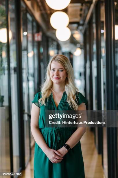 portrait of office employee wearing green dress - green blouse stock pictures, royalty-free photos & images