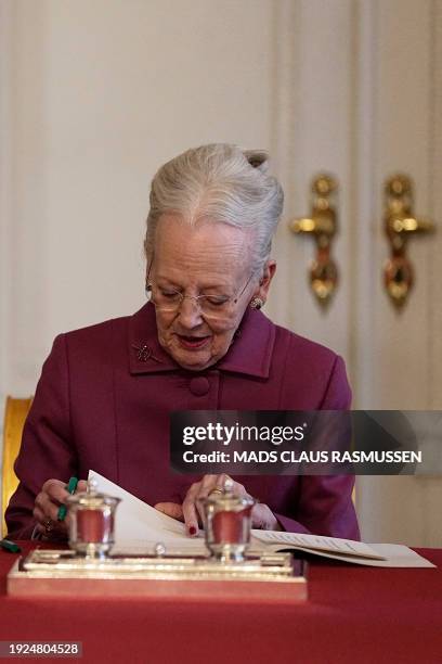 Queen Margrethe II of Denmark signs a declaration of abdication as Crown Prince Frederik of Denmark becomes King Frederik X of Denmark in the Council...