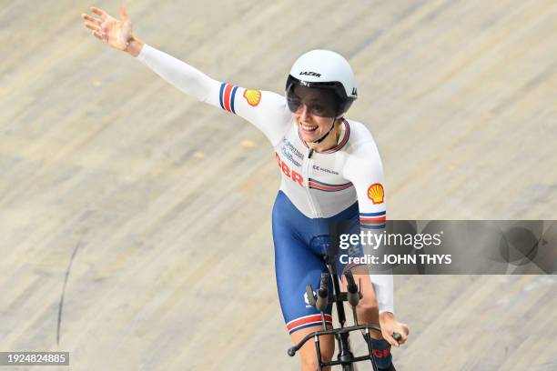 First placed Britain's Josie Knight celebrates winning gold after competing in the Women's Individual Pursuit finals race during the fifth day of the...