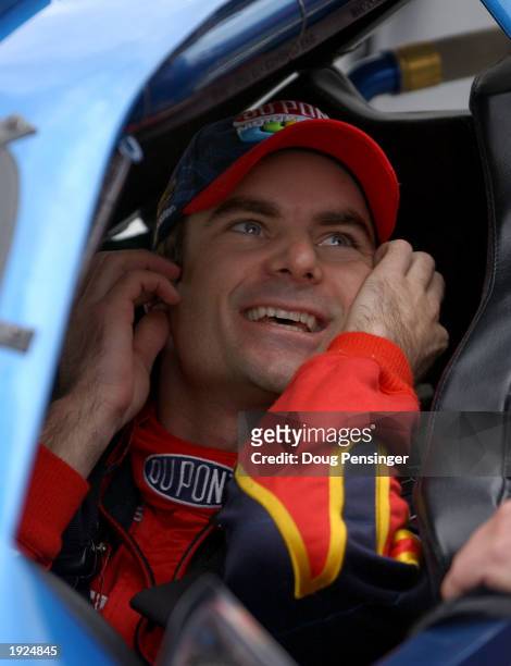 Jeff Gordon smiles from inside his DuPont Chevrolet after winning the pole position for the NASCAR Winston Cup Virginia 500 on April 11, 2003 at the...