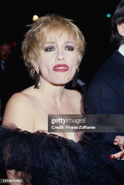 American actress Patti D'Arbanville, wearing a black off-shoulder outfit, attends the 2nd Annual American Cinematheque Award Salute, held at the...