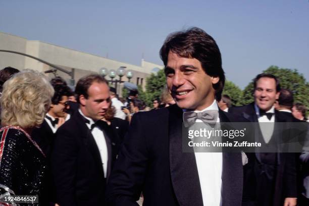 American actor Tony Danza, wearing a tuxedo and a black-and-grey striped bow tie, attends the 37th Primetime Emmy Awards, held at the Pasadena Civic...