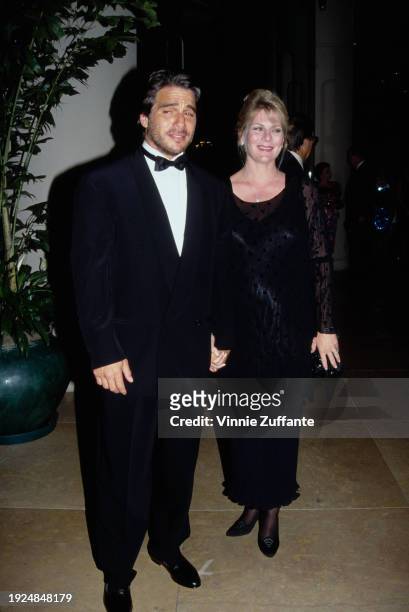 American actor Tony Danza, wearing a tuxedo and bow tie, and his wife, Tracy, wearing a full-length black dress with black lace sleeves, attend the...