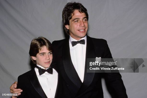 American actor Tony Danza and his son, Marc, both dressed in tuxedos and bow ties, attend the 43rd Golden Globe Awards, held at Beverly Hilton Hotel...