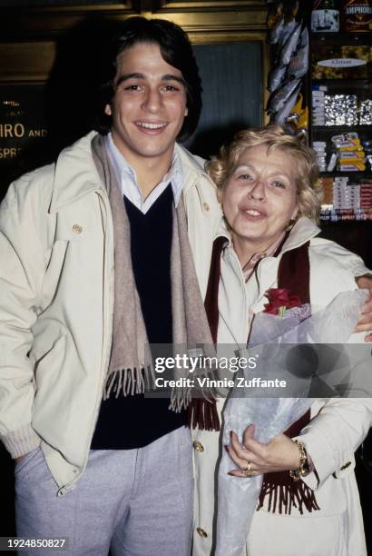 American actor Tony Danza, wearing a white jacket over a black sweater and white shirt, with a beige scarf, with his arm around his mother, Anna, who...