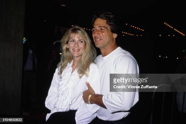 American actor Tony Danza, wearing a white long-sleeve t-shirt, and his wife, Tracy, who wears a white ruffled blouse, attend the Century City...