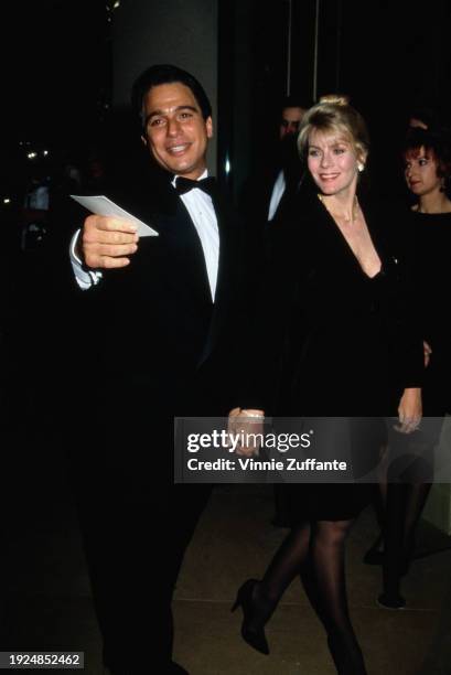 American actor Tony Danza, wearing a tuxedo and bow tie, and his wife, Tracy, who wears a black suit, attend the 19th Annual American Film Institute...