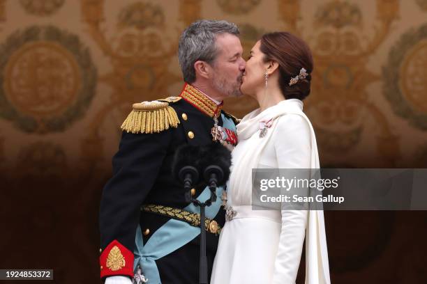 Danish King Frederik X kisses his wife Queen Mary of Denmark after his proclamation by the Prime Minister, Mette Frederiksen on the balcony of...