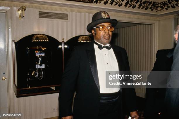 American singer and guitarist Bo Diddley, wearing a tuxedo and bow tie with his trademark hat, attends the 2nd Annual Rock and Roll Hall of Fame...