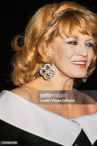 American actress Angie Dickinson, wearing a black-and-white off-shoulder outfit, attends the 19th Annual American Film Institute Lifetime Achievement...