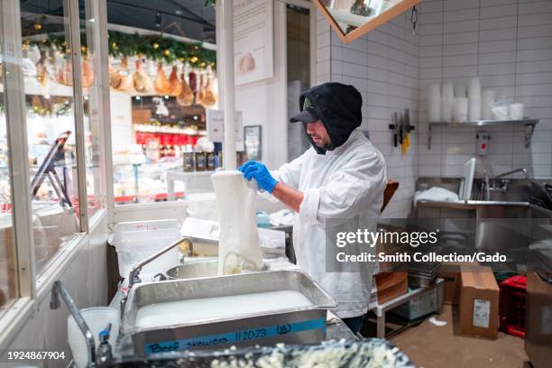 Chef preparing fresh mozzarella cheese in the artisanal kitchen at Eataly, Westfield Mall, San Jose, California, December 2, 2023.