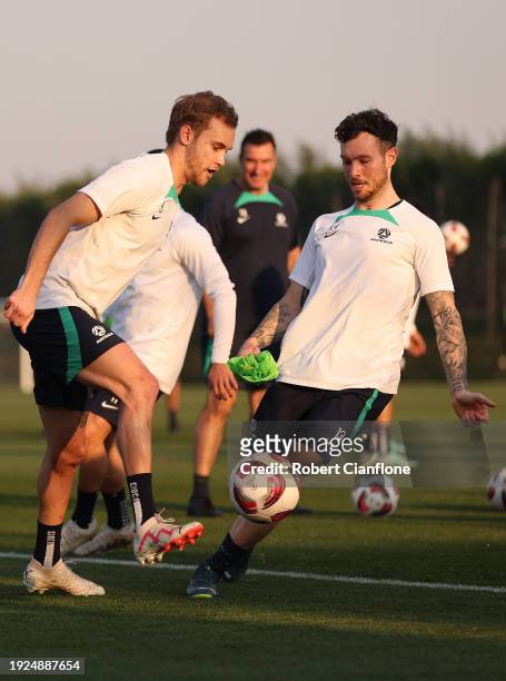 Nathaniel Atkinson of Australia kicks the ball during an Australia Socceroos training session ahead of the the AFC Asian Cup at Qatar University...