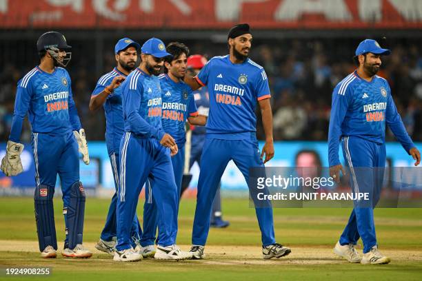 India's Ravi Bishnoi celebrates with teammates after taking the wicket of Afghanistan's Rahmanullah Gurbaz during the second Twenty20 international...