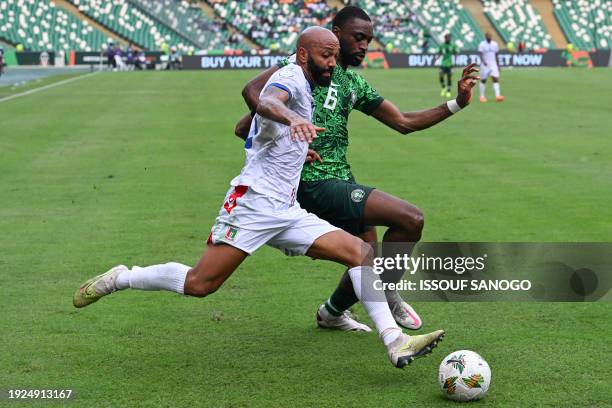 Equatorial Guinea's forward Emilio Nsue fights for the ball with Nigeria's defender Semi Ajayi during the Africa Cup of Nations 2024 group A football...