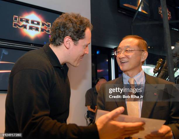 Director Jon Favreau talks with Michael Ahn, CEO of LG Electronics North America during opening day at the International Consumer Electronics Show ,...
