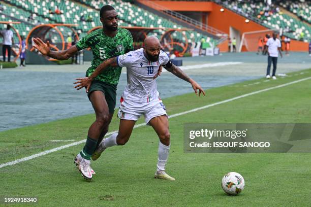 Nigeria's defender Semi Ajayi fights for the ball with Equatorial Guinea's forward Emilio Nsue during the Africa Cup of Nations 2024 group A football...