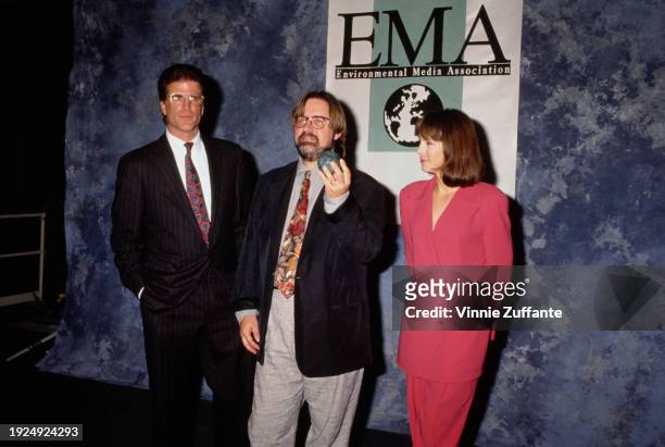 American actor Ted Danson, wearing a black pinstripe suit over a white shirt and a red-and-blue tie, American cartoonist and animator Matt Groening,...
