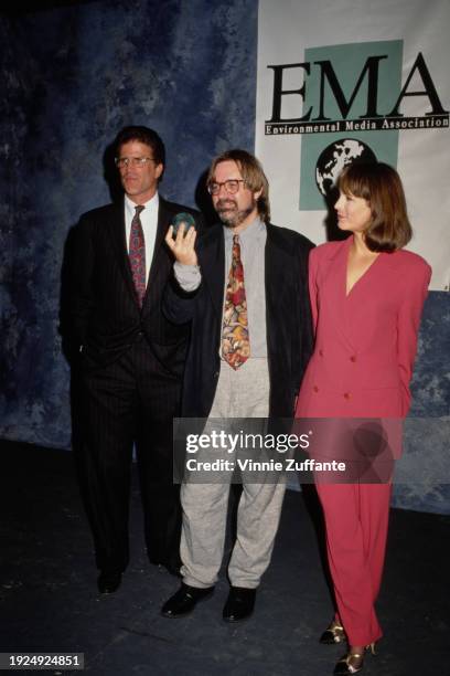 American actor Ted Danson, wearing a black pinstripe suit over a white shirt and a red-and-blue tie, American cartoonist and animator Matt Groening,...