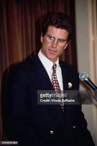 American actor Ted Danson, wearing a dark blue blazer over a pinstripe shirt and a patterned tie, attends the 1991 Gleitsman Foundation Citizen...