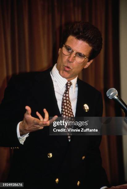 American actor Ted Danson, wearing a dark blue blazer over a pinstripe shirt and a patterned tie, attends the 1991 Gleitsman Foundation Citizen...