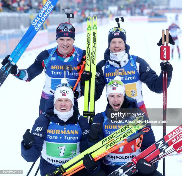 Sturla Holm Laegreid, Johannes Dale-Skjevdal, Tarjei Boe and Vetle Sjaastad Christiansen of Norway celebrate victory after the Men 4x7.5 km Relay at...