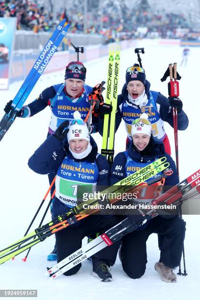 Sturla Holm Laegreid, Johannes Dale-Skjevdal, Tarjei Boe and Vetle Sjaastad Christiansen of Norway celebrate victory after the Men 4x7.5 km Relay at...
