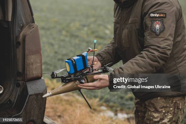 Ukrainian FPV drone pilot of the 24th Mechanized Brigade prepares an assembled FPV drone with explosives before take-off on December 19, 2023 in...