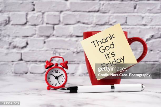 thank god it's friday text on adhesive note - closing time stock pictures, royalty-free photos & images