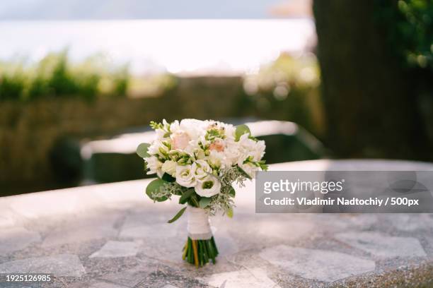 close-up of flower vase on table - lisianthus stock pictures, royalty-free photos & images