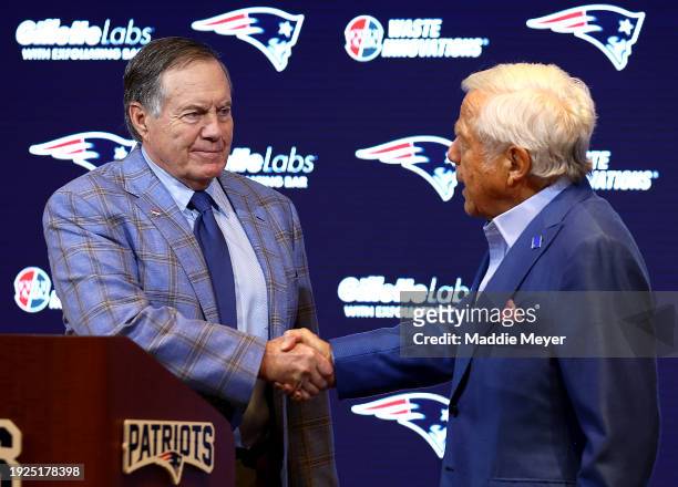 Head coach Bill Belichick of the New England Patriots shakes hands with owner Robert Kraft during a press conference at Gillette Stadium on January...