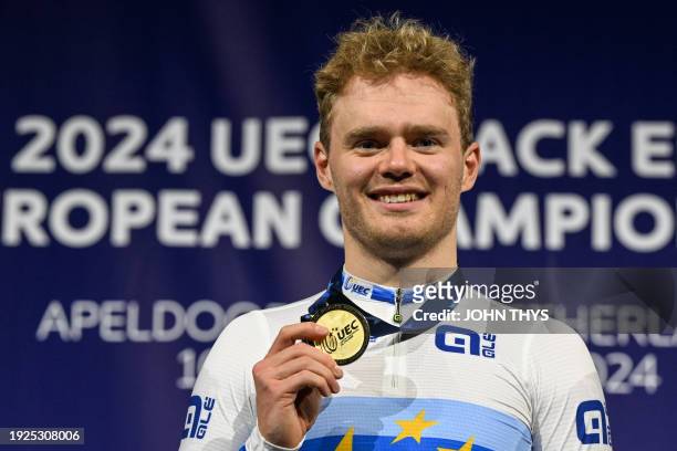 First placed Denmark's Niklas Larsen celebrates with his gold medal on the podium of the Men's Points race during the fifth day of the UEC European...